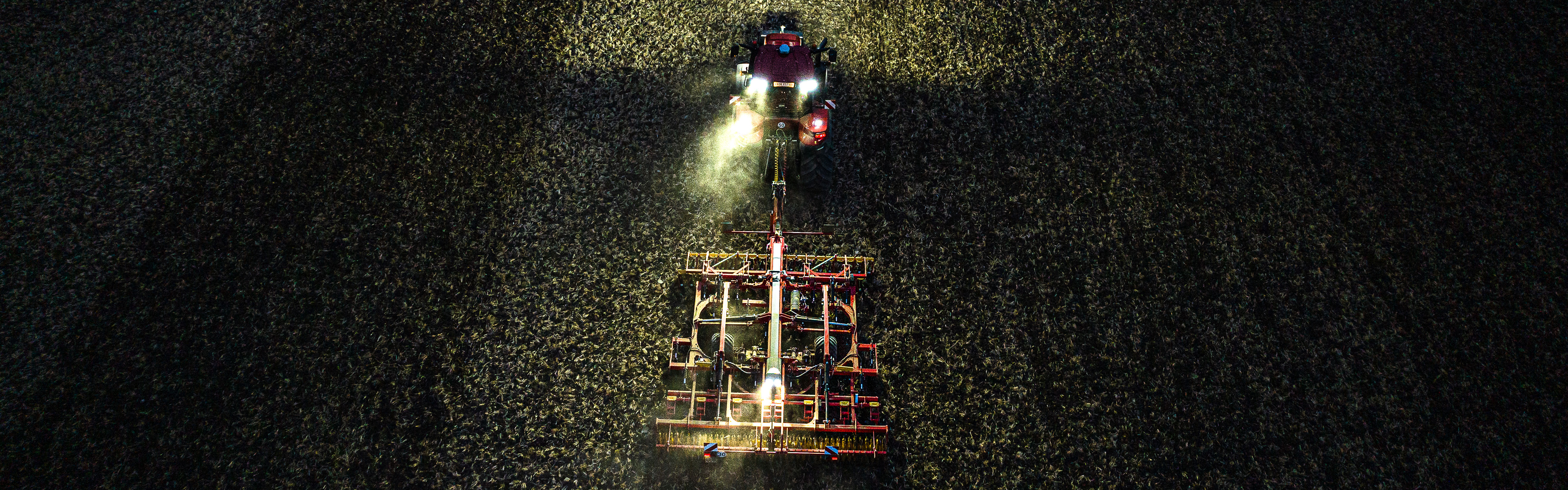Cultivator drives in the dark.