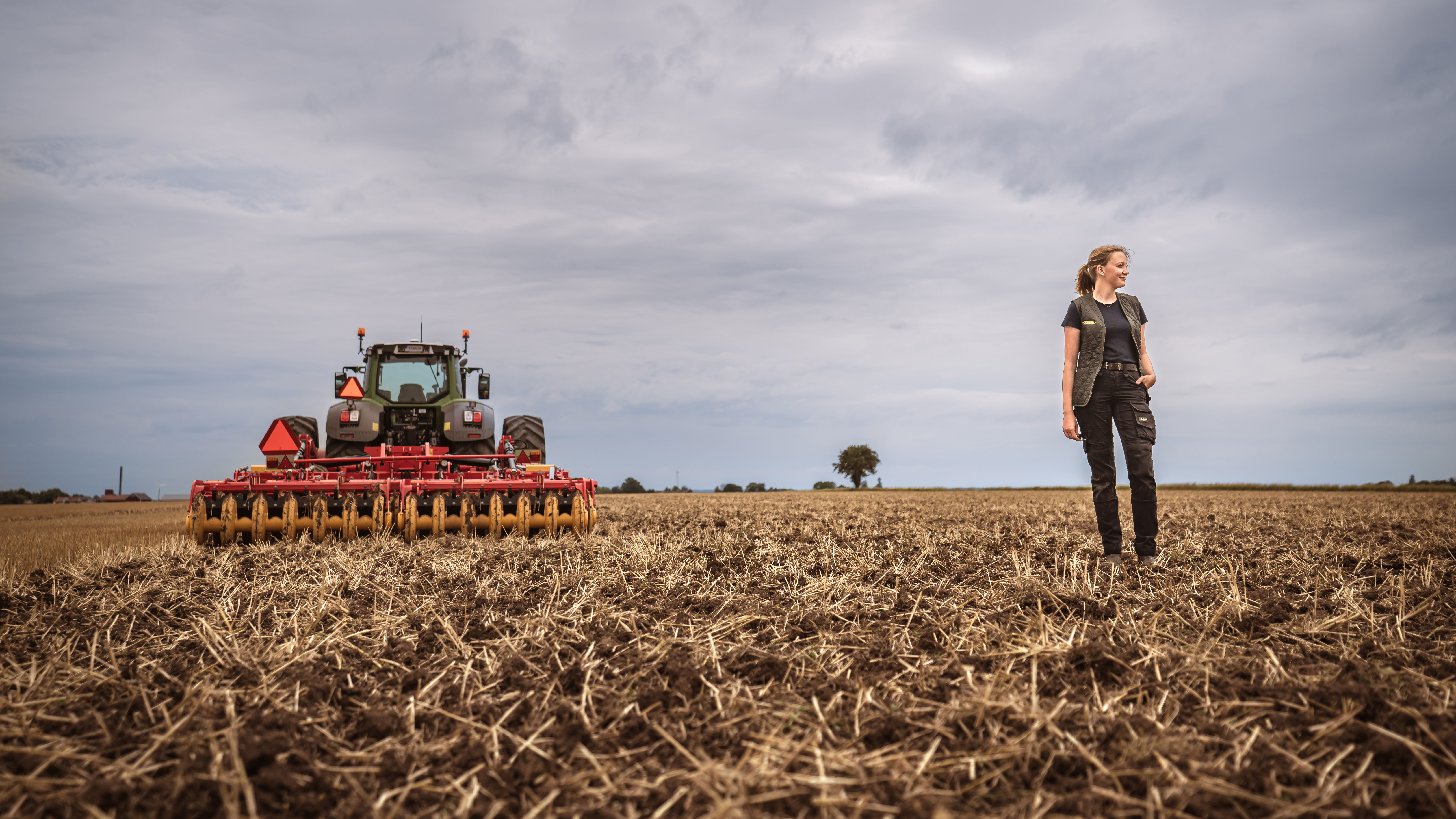 A girl standing on the field.