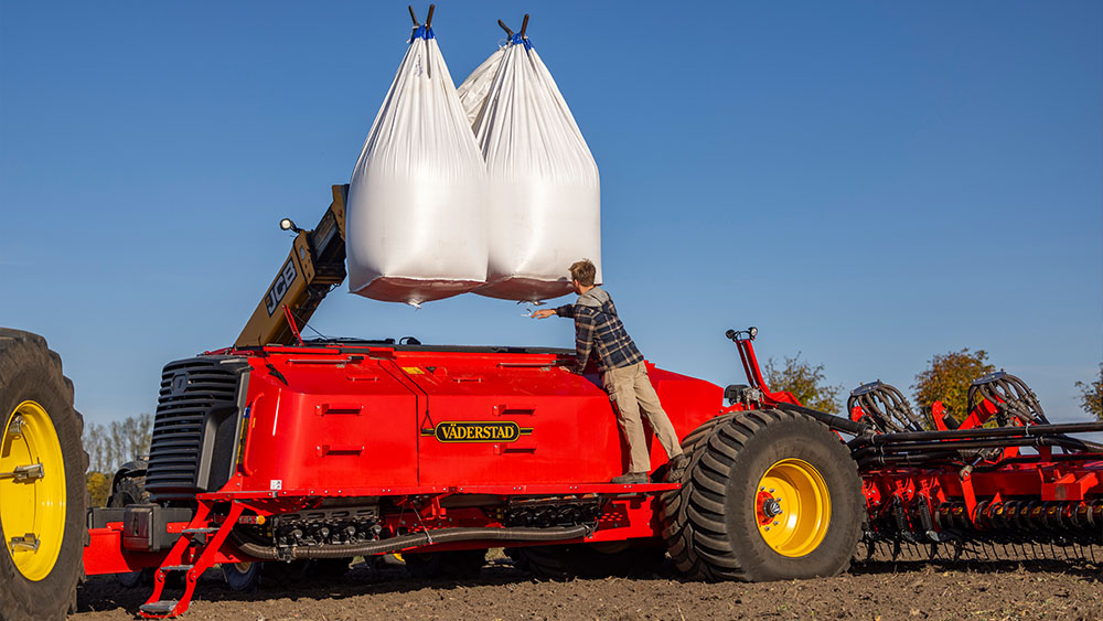 Filling the hopper with seeds